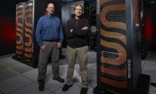 Brian Van Essen and Bronis R. de Supinski standing with the SambaNova AI hardware